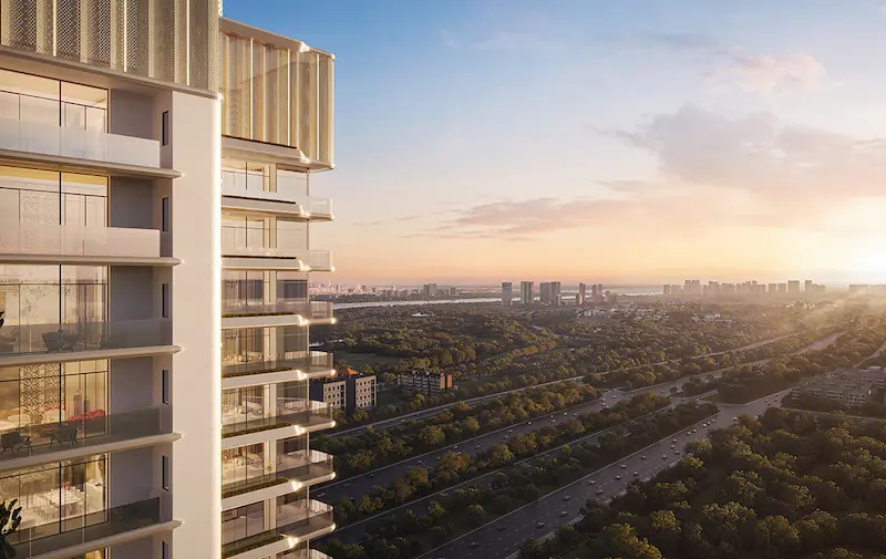 Exterior view of Smartworld Elie Saab luxury apartments in Sector 98, showcasing modern architecture and panoramic sunset views over the Noida Expressway